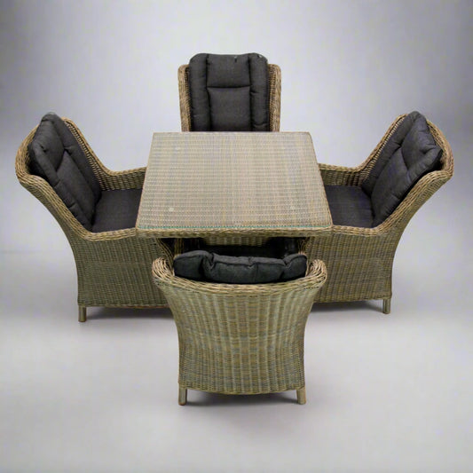 Outdoor poly rattan wicker dining set with four cushioned chairs and square table, natural brown.
