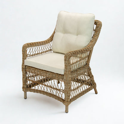 Wicker armchair hampton style with white cushions on a white background