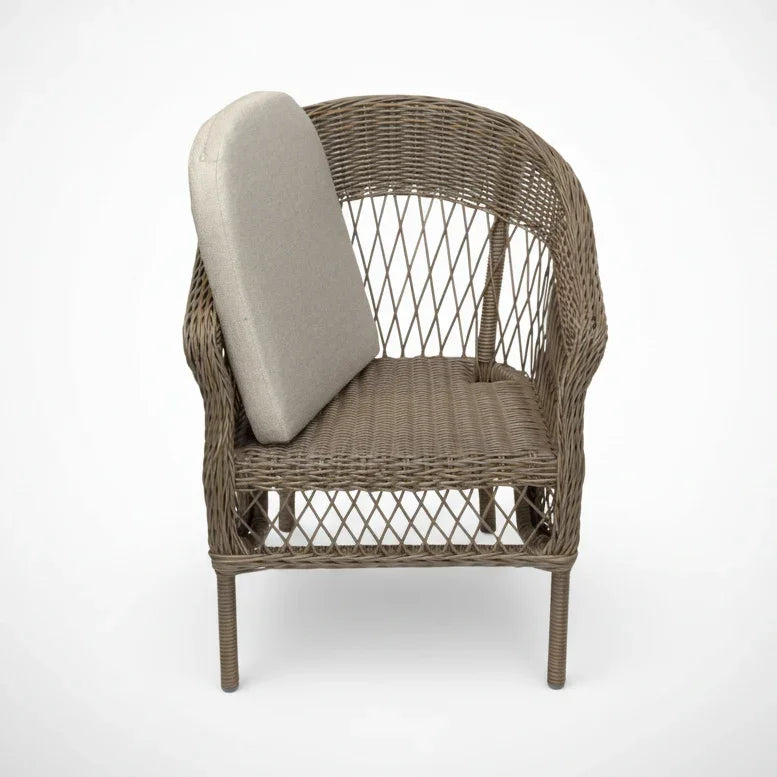A brown woven wicker patio armchair with a curved backrest and a light beige cushion on the seat and back, shown against a plain white background.