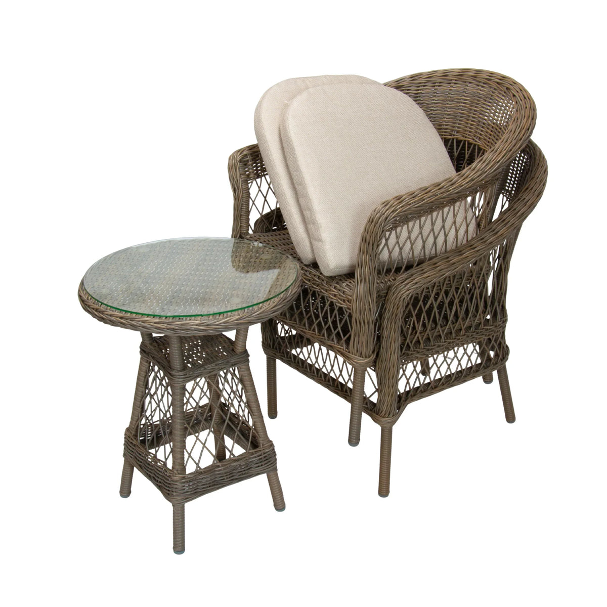 A wicker patio set featuring a round side table with a glass top and a matching armchair with a cream beige cushion, isolated on a white background.