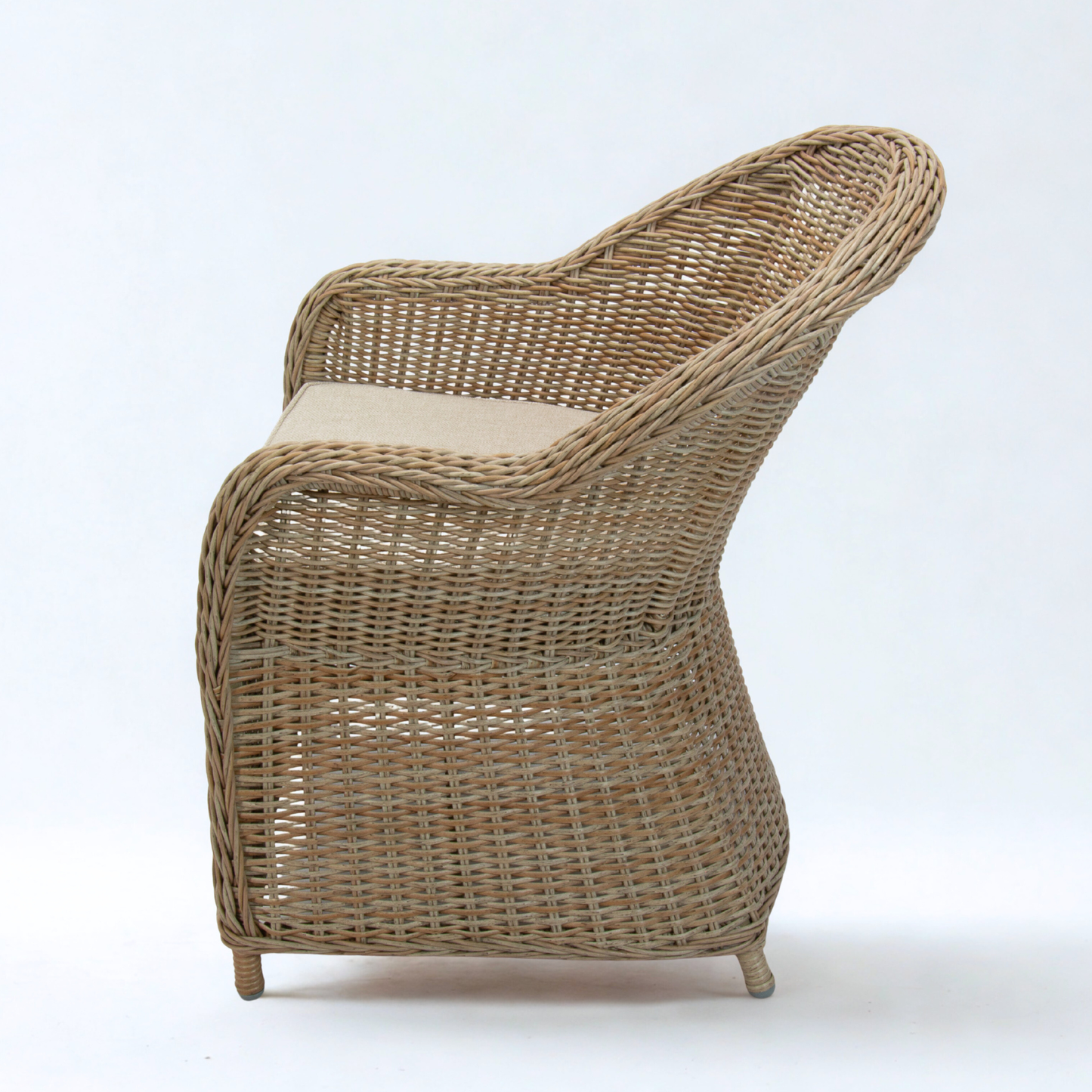 wicker dining chair in natural colour and beige cushion