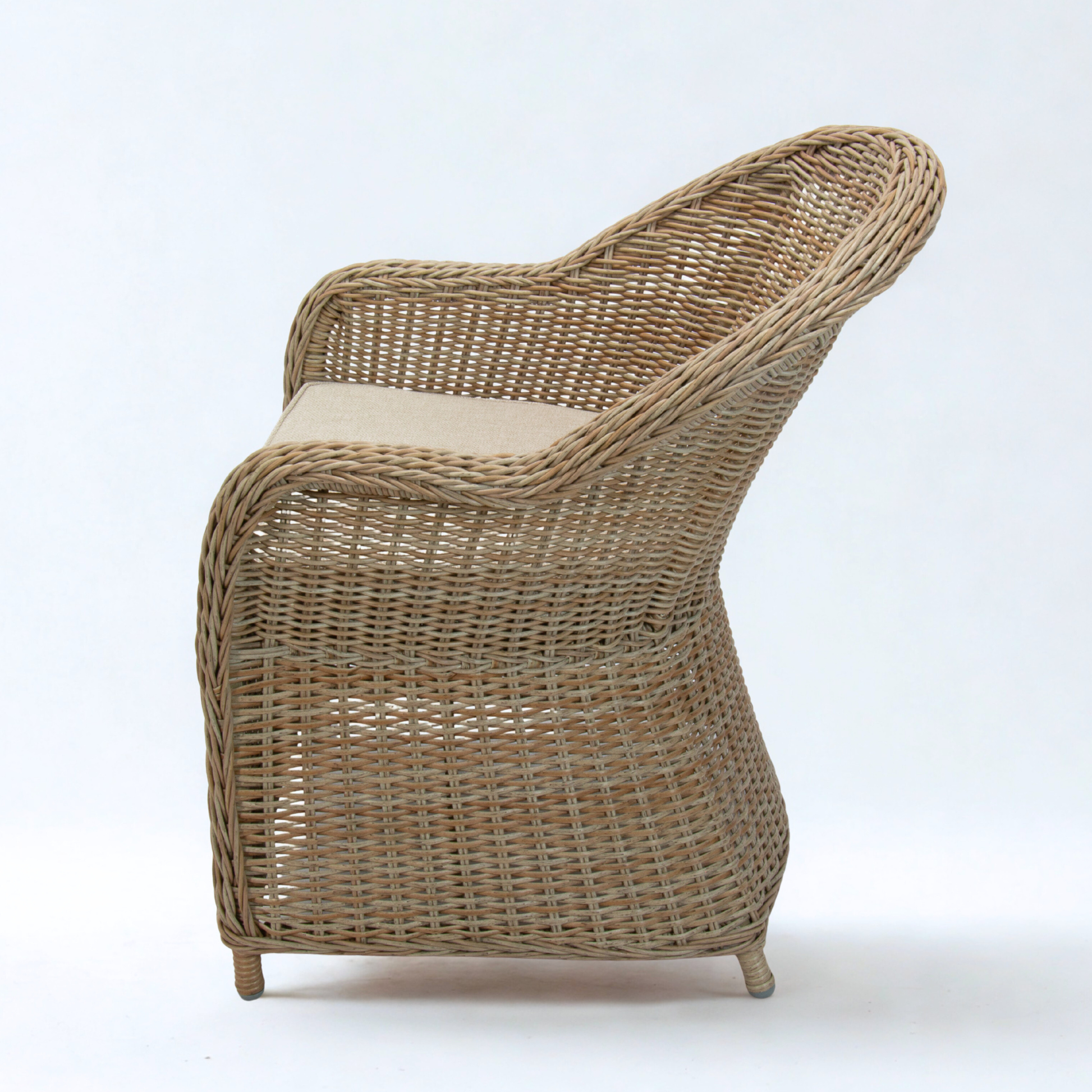 wicker dining chair in natural colour and beige cushion