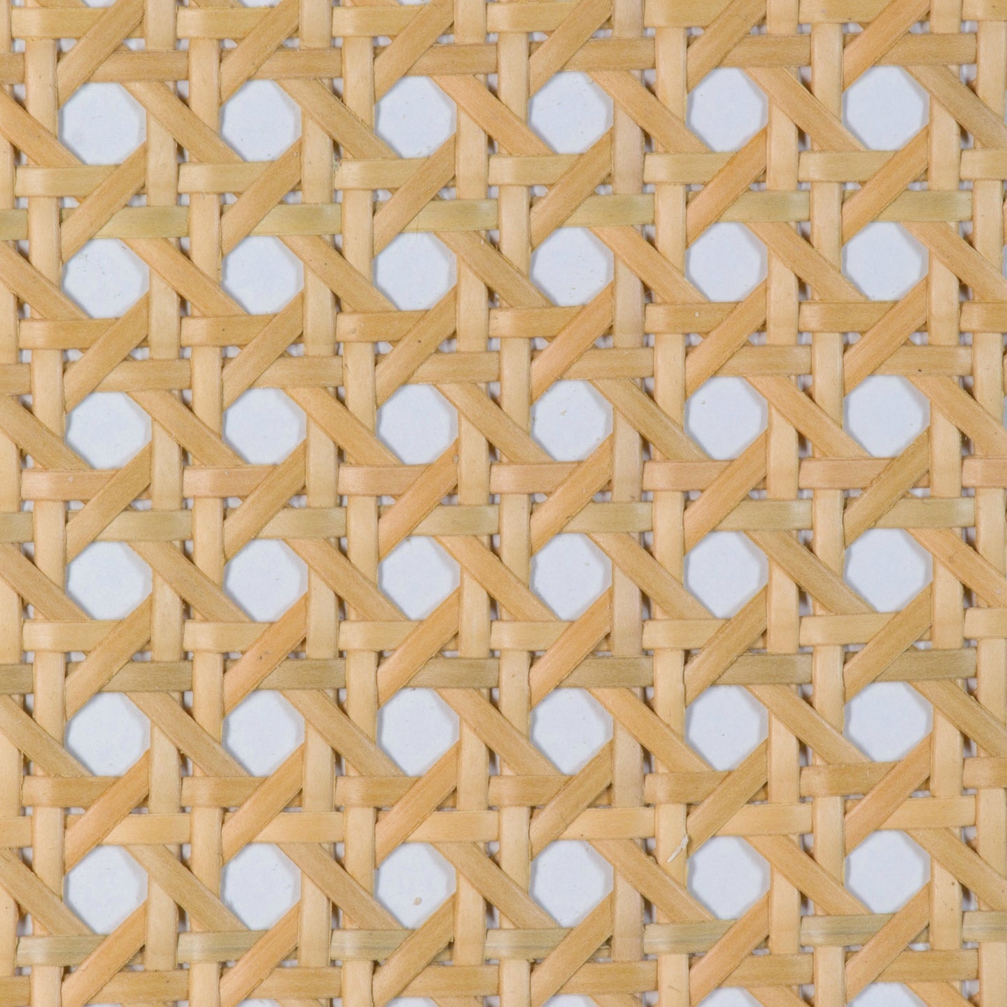 lose-up of a woven pattern with hexagonal rattan cane webbing plastic in natural light brown