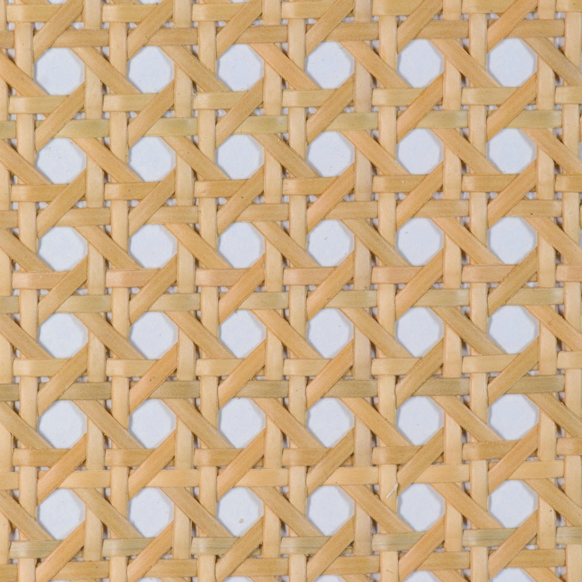 lose-up of a woven pattern with hexagonal rattan cane webbing plastic in natural light brown