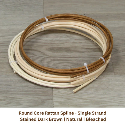 Round core rattan spline strands in natural and dark brown, coiled on wooden floor