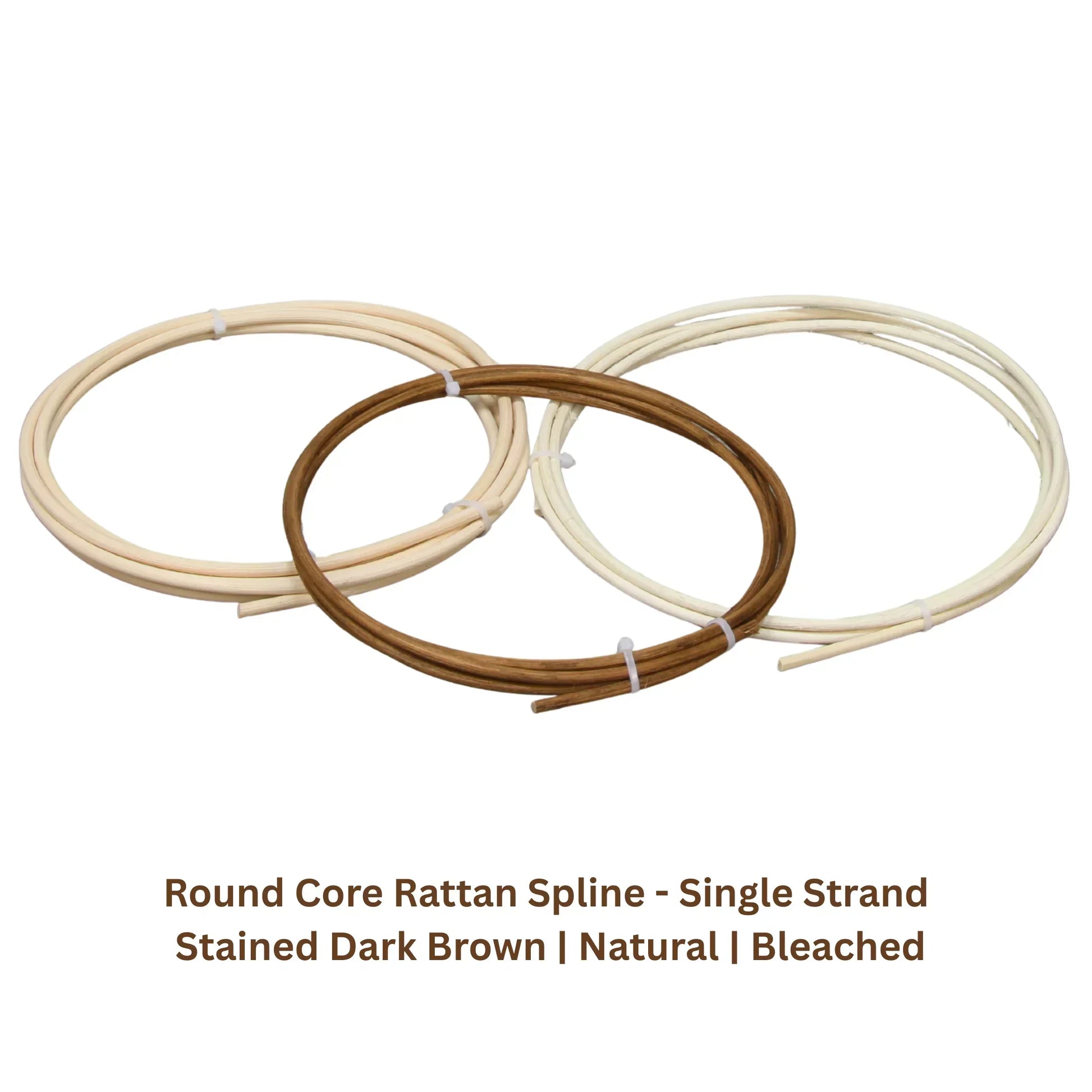 Three coils of round core rattan spline in natural, bleached, and stained dark brown colors.